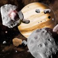 In this artist's conception, Jupiter's migration through the solar system has swept asteroids out of stable orbits, sending them careening into one another. As the gas giant planets migrated, they stirred the contents of the solar system. Objects from as close to the Sun as Mercury, and as far out as Neptune, all collected in the main asteroid belt, leading to the diverse composition we see today. (Image by David A. Aguilar)