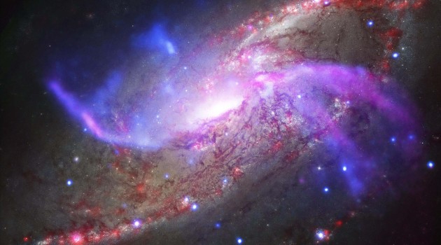 This galactic fireworks display is taking place in NGC 4258 (also known as M106), a spiral galaxy like the Milky Way. (Image credit: NASA/CXC/JPL-Caltech/STScI/NSF/NRAO/VLA)