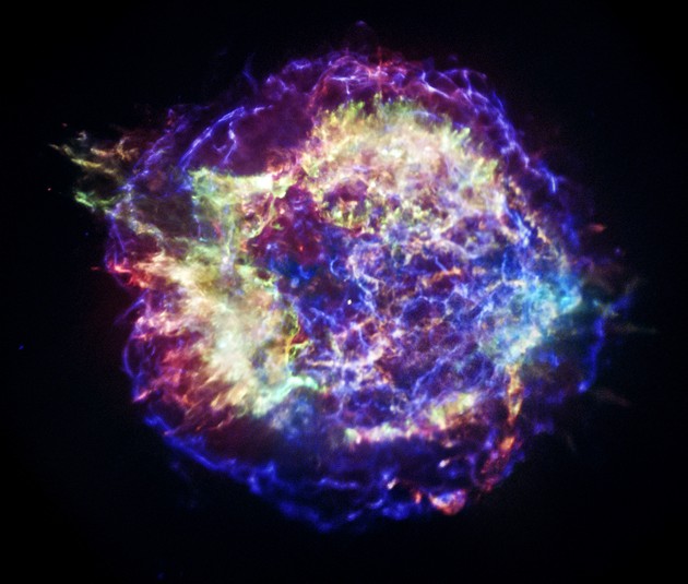 A photograph of Cas A from NASA's Chandra X-ray Observatory reveals the supernova remnant's complex structure. In this representative-color image low-energy X-rays are red, medium-energy ones are green, and the highest-energy X-rays detected by Chandra are colored blue. (Image: NASA/CXC/SAO)