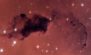 This Hubble image features dark knots of gas and dust known as "Bok globules," which are dense pockets in larger molecular clouds. Similar islands of material in the early universe could have held as much water vapor as we find in our galaxy today, despite containing a thousand times less oxygen. (Photo by NASA, ESA, and The Hubble Heritage Team)