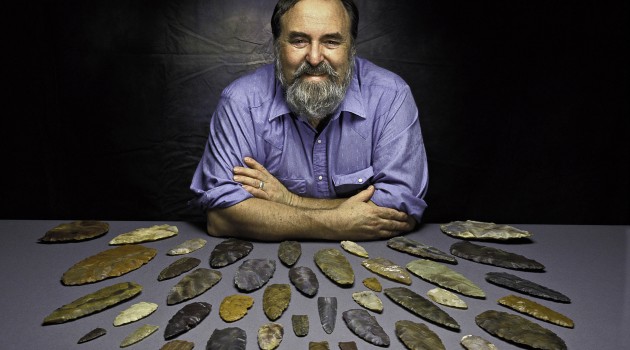 Image left: Dennis Stanford with Clovis stone points from the collection of the Smithsonian's National Museum of Natural History. (Photo by Chip Clark)