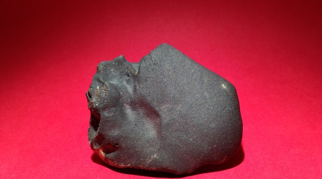 The main mass of the rare Sutter's Mill meteorite before the Smithsonian Institution cut it and divided among five academic institutions: the Smithsonian Institution, American Museum of Natural History, The Field Museum of Chicago, Arizona State University and UC Davis. The 205 gram mass is the largest stone recovered from the meteorite that exploded over California's Sierra foothills in April 2012. (Smithsonian Institution photo)