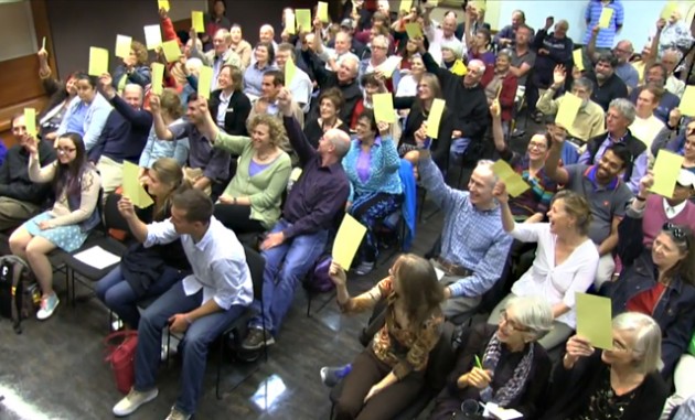 On Sept. 18, 2014, audience members who attended the Observatory Night talk "What is a Planet?" voted to choose one of three possible definitions for a planet. The result: a planet is "the smallest spherical lump of matter than formed around stars or stellar remnants," and Pluto IS a planet! (Photo: Harvard-Smithsonian CfA)