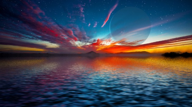 This artist's depiction shows a gas giant planet rising over the horizon of an alien waterworld. New research shows that oceans on super-Earths, once established, can last for billions of years. (Image by David A. Aguilar)